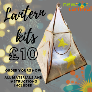 A square image with a photo of a white hand made willow and tissue lantern lit up from inside, it is in the shape of a pyramid.